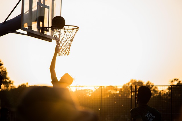 Teenagers practicing basketball shots